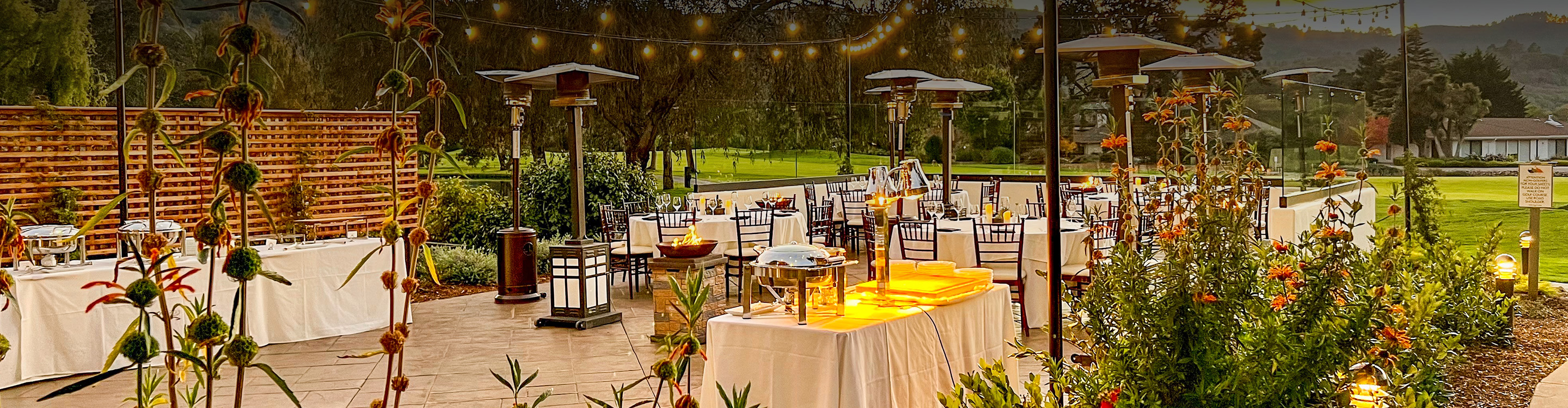 a patio with tables and chairs