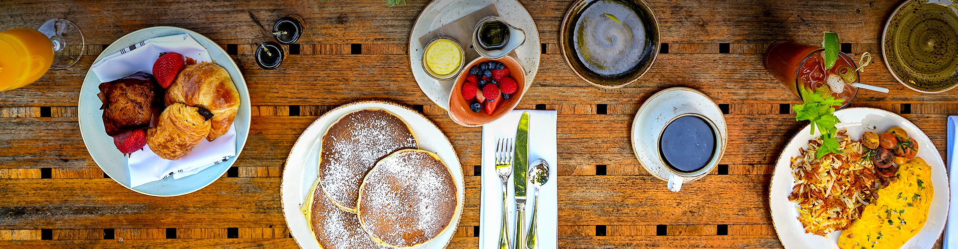 a plate of pancakes with berries