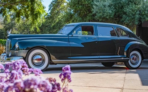 a black car parked in a driveway