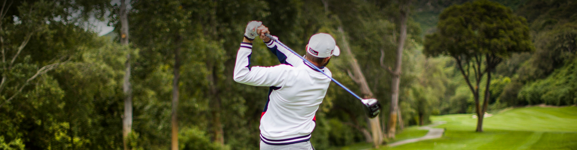 a man swinging a golf club