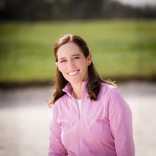 a woman smiling at the camera