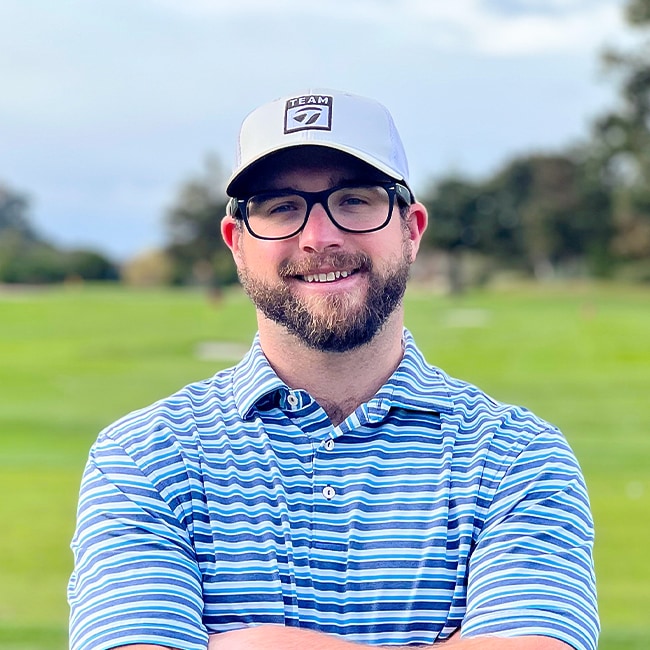 a man wearing glasses and a hat